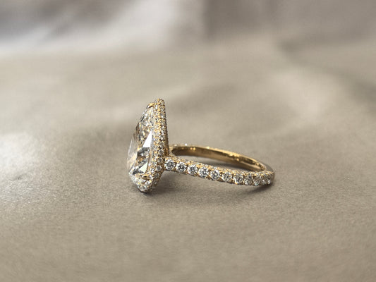 4 Carat Pear-Shaped Lab Diamond Ring | 14K Yellow Gold | 2mm Band Width | 1 Carat Melee Halo Setting | Luxurious Full Surround Design