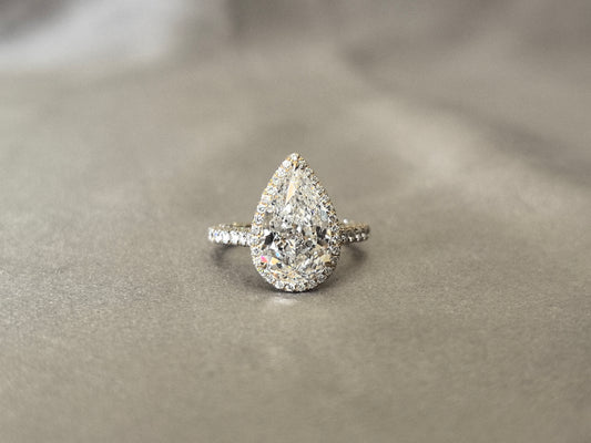 4 Carat Pear-Shaped Lab Diamond Ring | 14K Yellow Gold | 2mm Band Width | 1 Carat Melee Halo Setting | Luxurious Full Surround Design