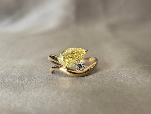 3Carat Vivid Yellow Pear-Shaped Lab Diamond Ring | White Round Side Diamond | 18K Yellow Gold | Asymmetrical Band | Three-Prong Setting