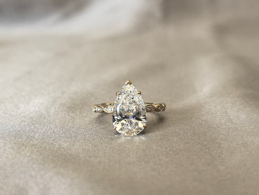 4 Carat Pear-Shaped Lab Diamond Ring | 14K Yellow Gold | Triple Marquise-Style Round Diamond Accents on Each Side | Symmetrical Cluster Design