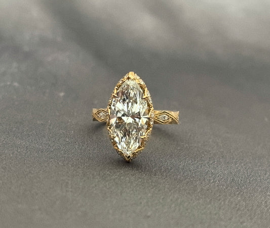 3-carat marquise-cut diamond ring | vintage carved design with scroll and lattice engraving | tulip-shaped setting | lab-grown diamond