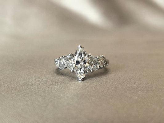 Marquise-shaped lab diamond ring | Upside-down teardrop design on both sides | Pear-shaped side stones | Elongated proportions