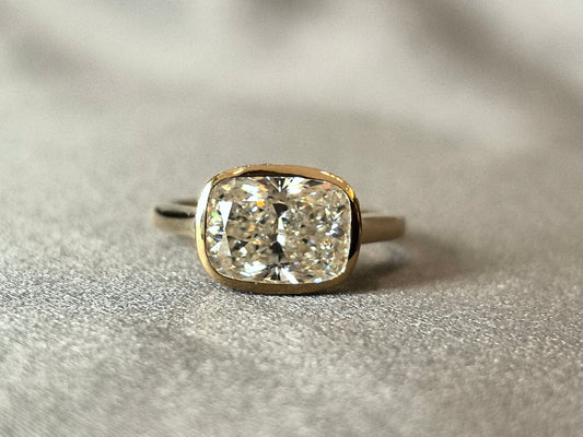 5-carat cushion setting, 14K gold, bezel-set, horizontal design