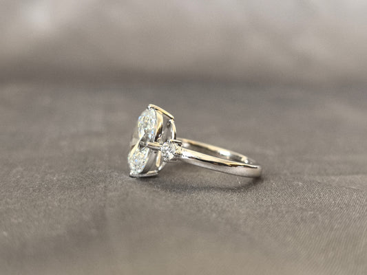 3  Carat Oval Lab Diamond Three-Stone Ring | Round Side Diamonds | 14K White Gold | Four-Claw Prong Setting | 2.2mm Band Width | Elegant Solitaire-Style Design