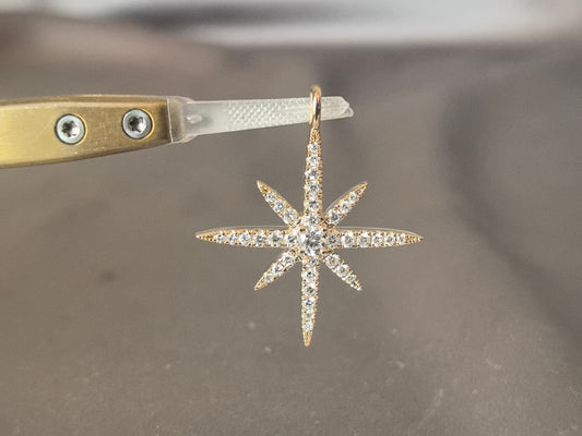 O-004|Pave-set starburst pendant|Full pave-set|Celestial-inspired silhouette|Central round diamond accent