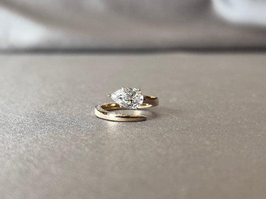 PE-012 | Pear-Cut Lab-Grown Diamond Bypass Solitaire Ring | Secure Prong-Set Pear-Cut & Pave Diamonds | Modern Bypass