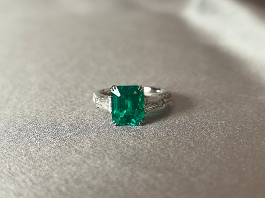 GR-005 | Emerald-Cut Lab-Grown Emerald Three-Stone Ring | Prong-Set | Fiery Tapered Baguette & Round Diamonds