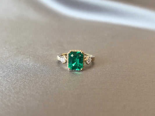 GR-012 | Emerald-Cut Emerald Three-Stone Ring | Delicate Handcrafted Milgrain Bezel | Elegant Vintage-Inspired Statement Ring