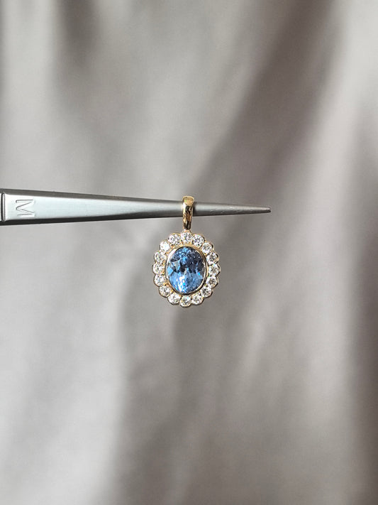 O-010 | Oval-Cut Aquamarine Halo Pendant | Bezel Setting | Accented by Round Brilliant Diamonds | Rotating Pendant
