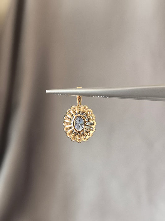 O-010 | Oval-Cut Aquamarine Halo Pendant | Bezel Setting | Accented by Round Brilliant Diamonds | Rotating Pendant