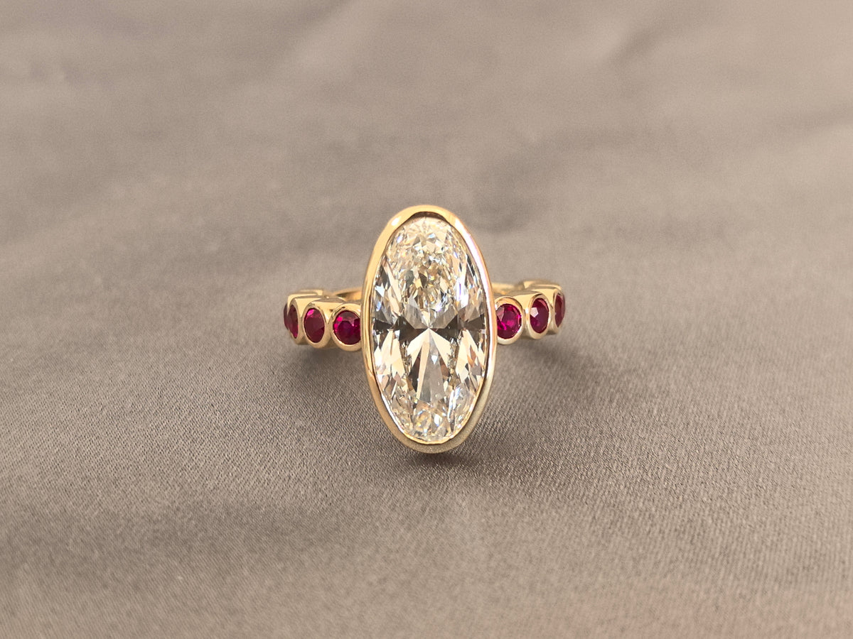 Juno Diamond OV-086 | 5 Carat White Moval Lab-Grown Diamond Bezel Ring with Red Diamond Accents Ring