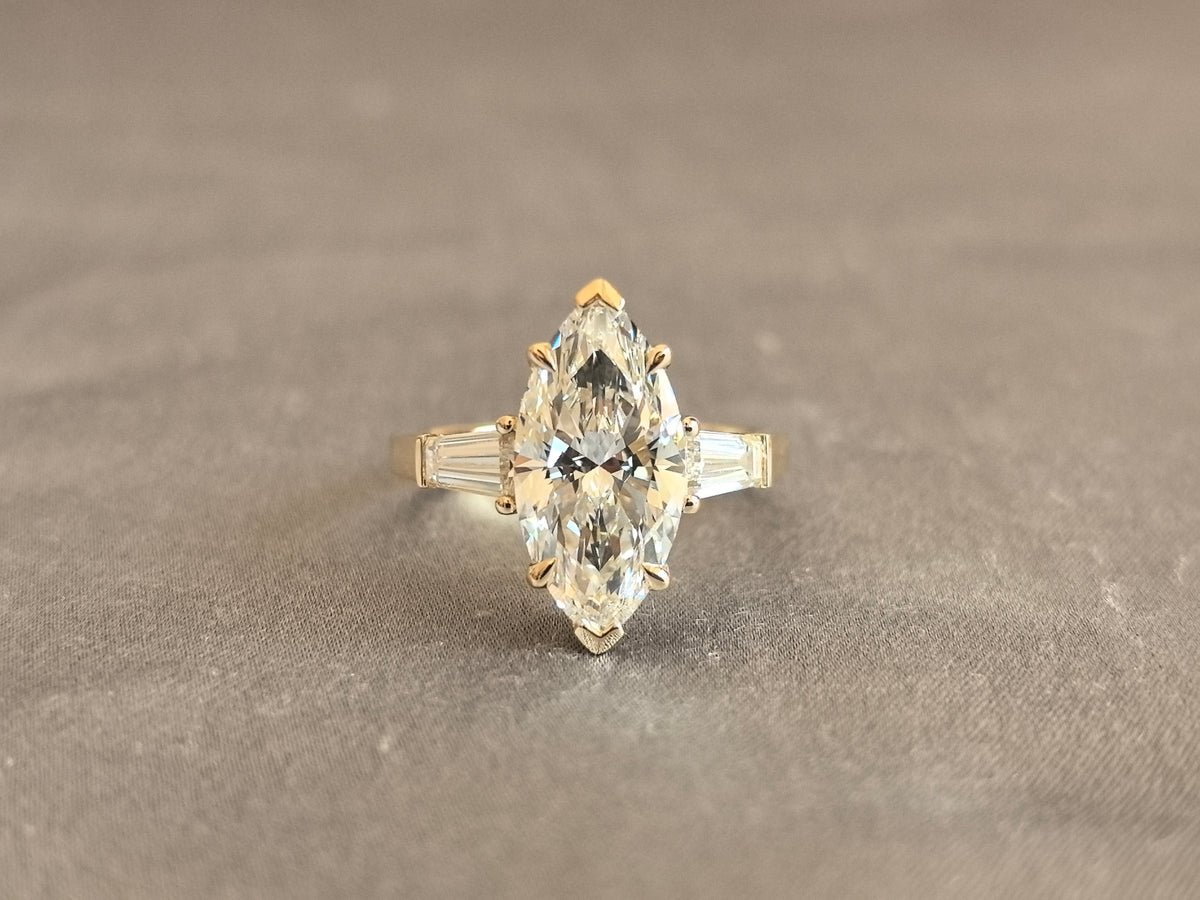 Juno Diamond MX-035 | 4 Carat Yellow Pear-Cut Lab-Grown Diamond Three Stone Ring with Symmetrical Tapered Baguette Arrangement in Yellow Gold Ring