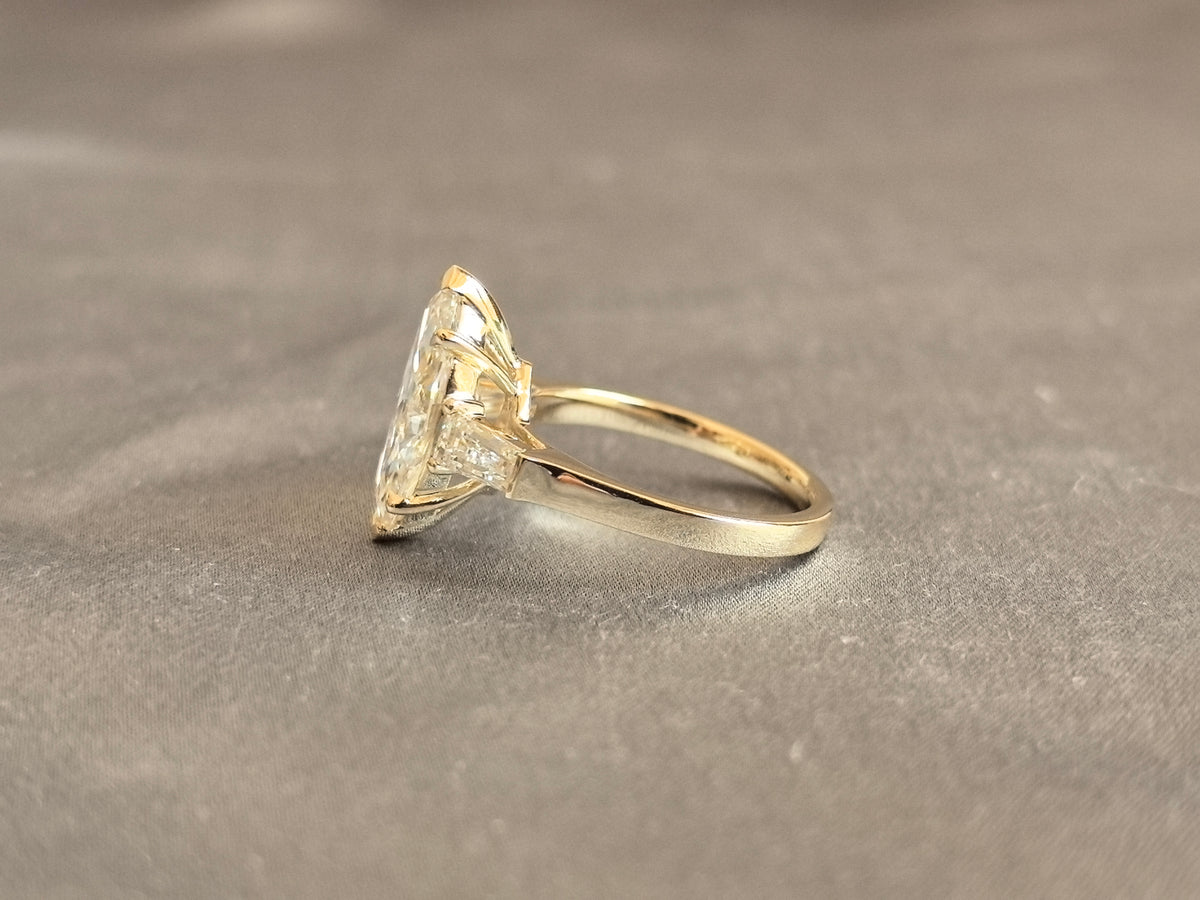 Juno Diamond MX-035 | 4 Carat Yellow Pear-Cut Lab-Grown Diamond Three Stone Ring with Symmetrical Tapered Baguette Arrangement in Yellow Gold Ring