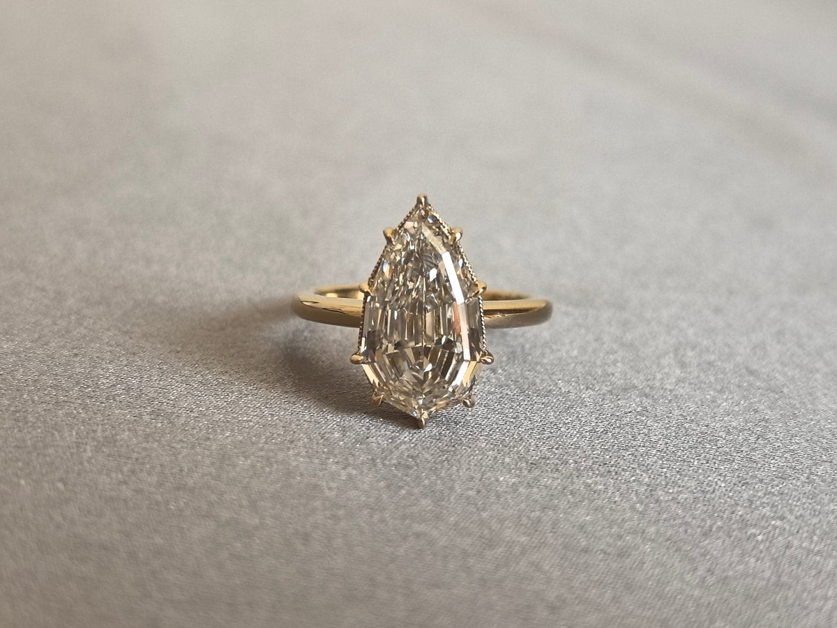 Juno Diamond PE-058 | 5 Carat Pear Step-Cut Lab-Grown Diamond Ring with Six-Prong Halo in Yellow Gold Ring