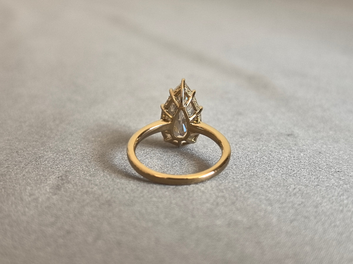 Juno Diamond PE-058 | 5 Carat Pear Step-Cut Lab-Grown Diamond Ring with Six-Prong Halo in Yellow Gold Ring