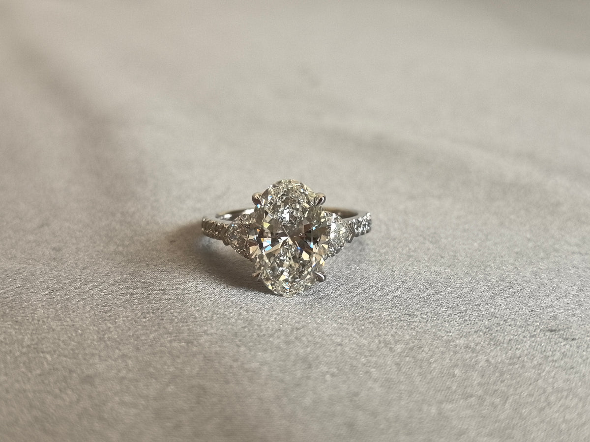 Juno Diamond OV-095 | 5 Carat Oval Center Lab-Grown Diamond Three Stone Ring with Tapered Pave Diamond Band Ring