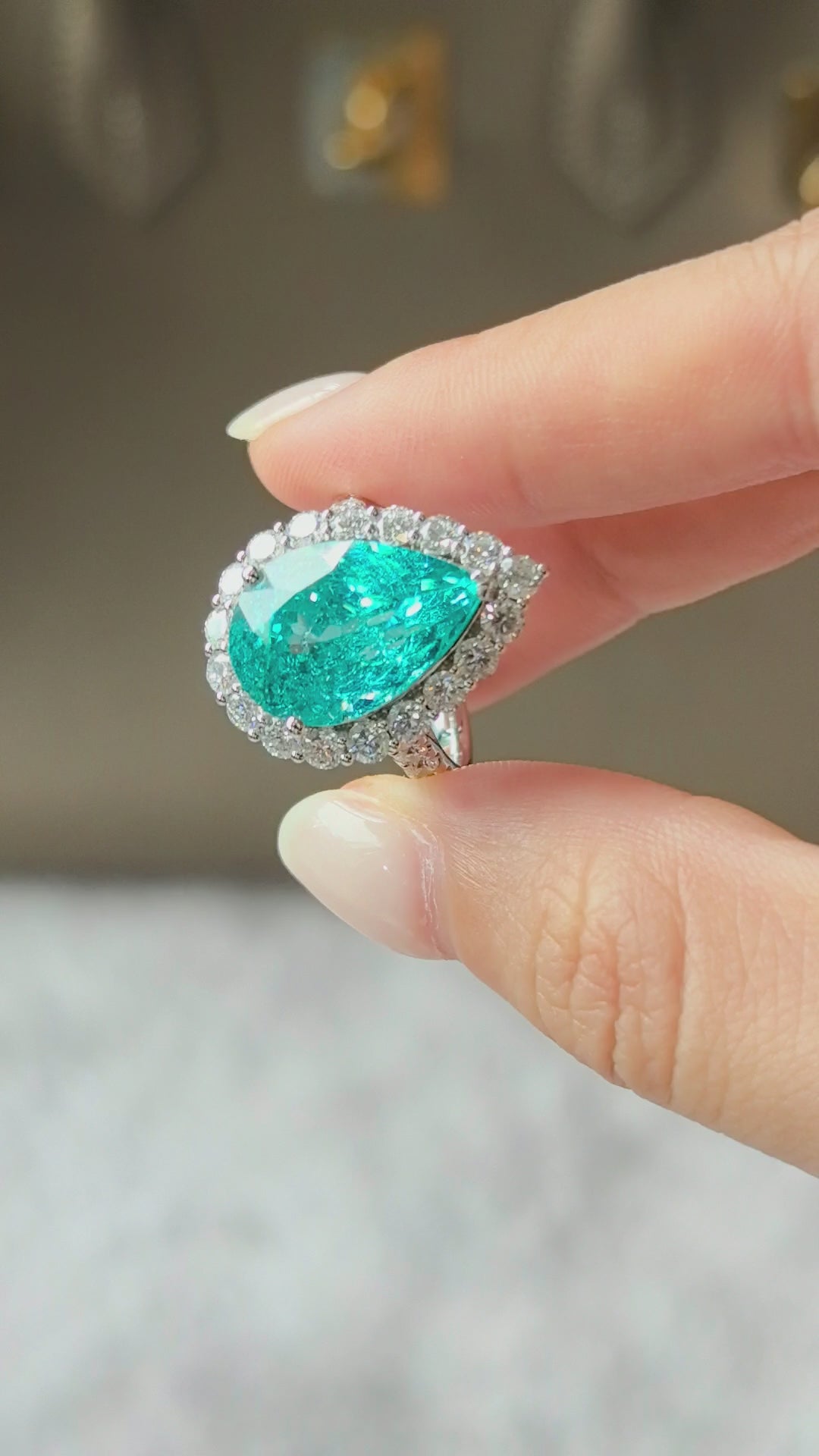 12ct 8.4g Paraiba Pear Halo Ring | Round Diamond Halo & Half Pavé Band
