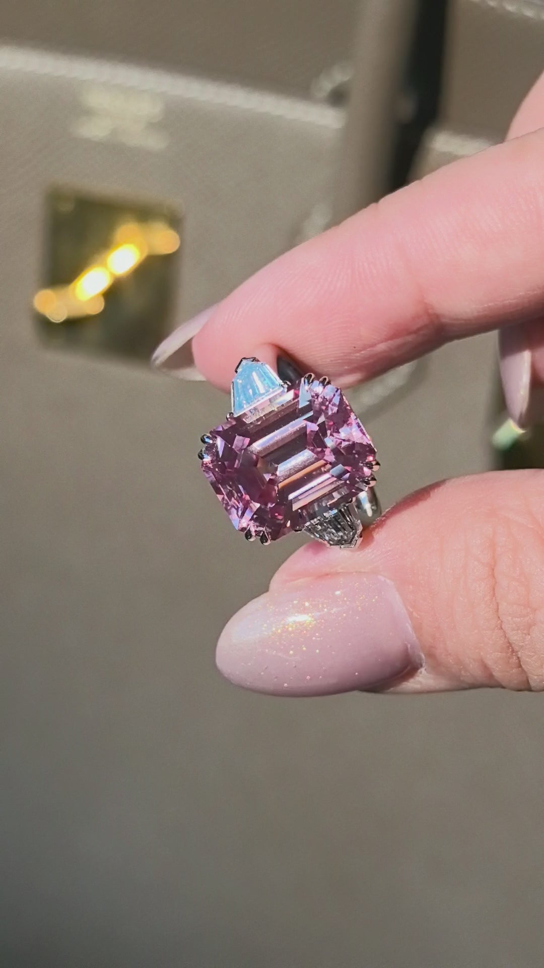 11.9ct 10.1g Emerald Cut Orangish Pink Sapphire Three-Stone Ring | Triangle Side Stones