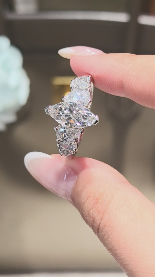 Marquise-shaped lab diamond ring | Upside-down teardrop design on both sides | Pear-shaped side stones | Elongated proportions