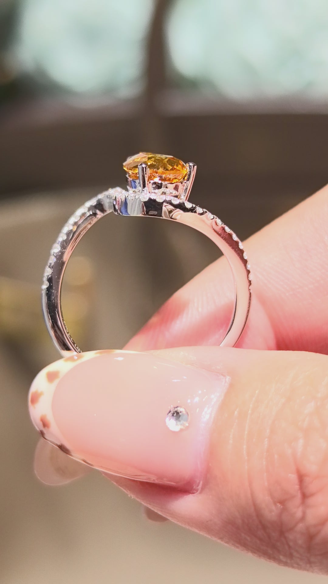 yellow pear-shaped lab-grown diamond pinky ring with small diamonds set on the band
